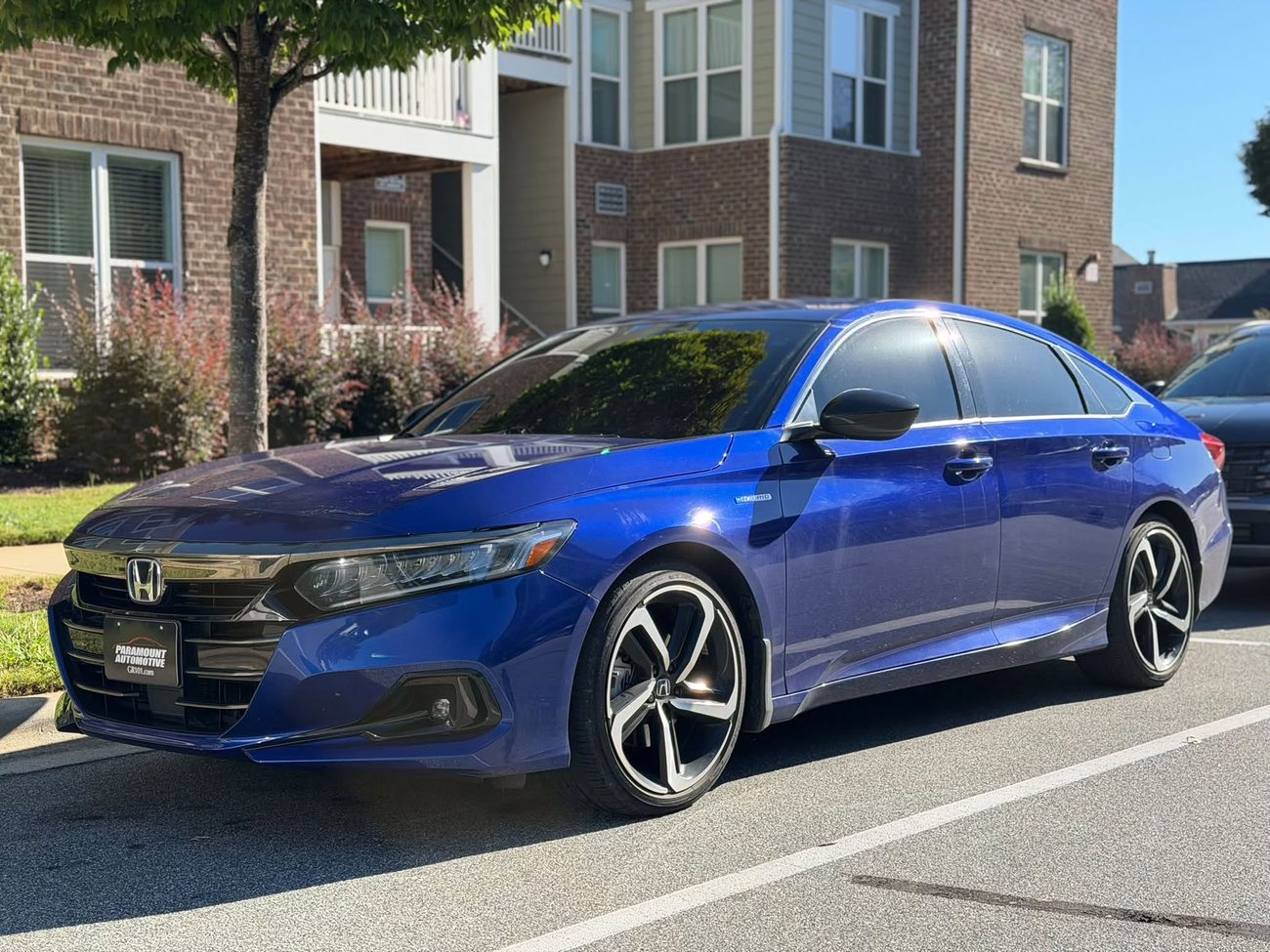 A blue sedan with freshly tinted windows, tinted by Stellar Tinting