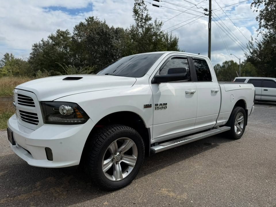 A white Ram pickup with tinted windows